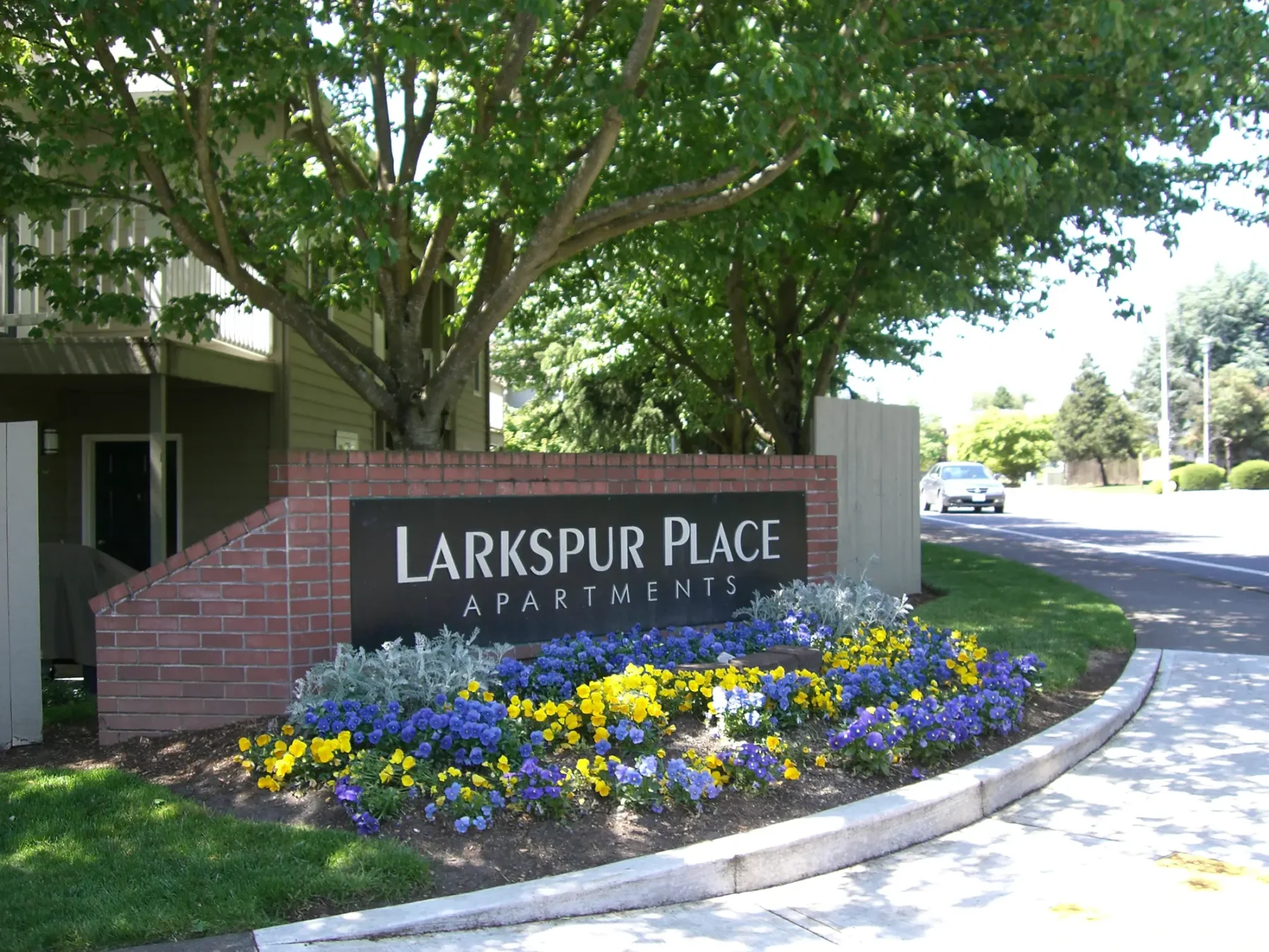 Brick monument sign for Larkspur Place apartments