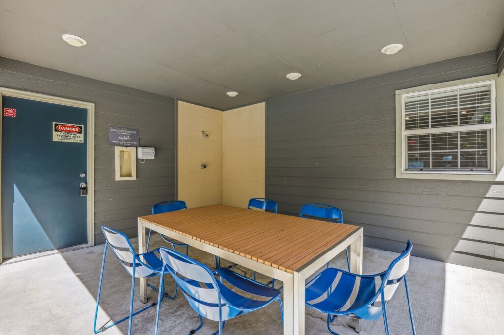 covered seating area with outdoor shower
