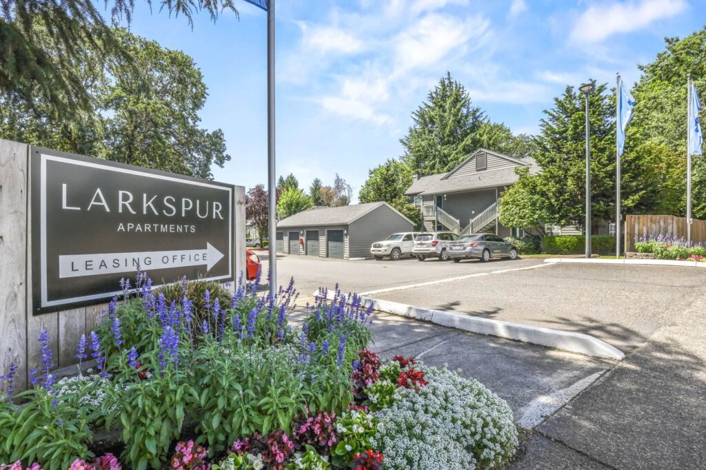 Larkspur Apartments Leasing Office exterior sign at apartment road entry